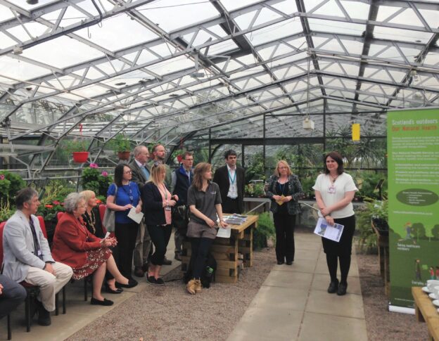 Senior Development Officer, Ailsa Villegas, welcomes guests to the Inverness Botanical Gardens